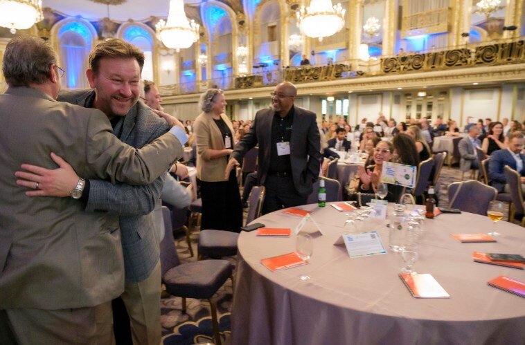 Crain's Best Place to Work - Doug Folger Hugging Steve Hopkins